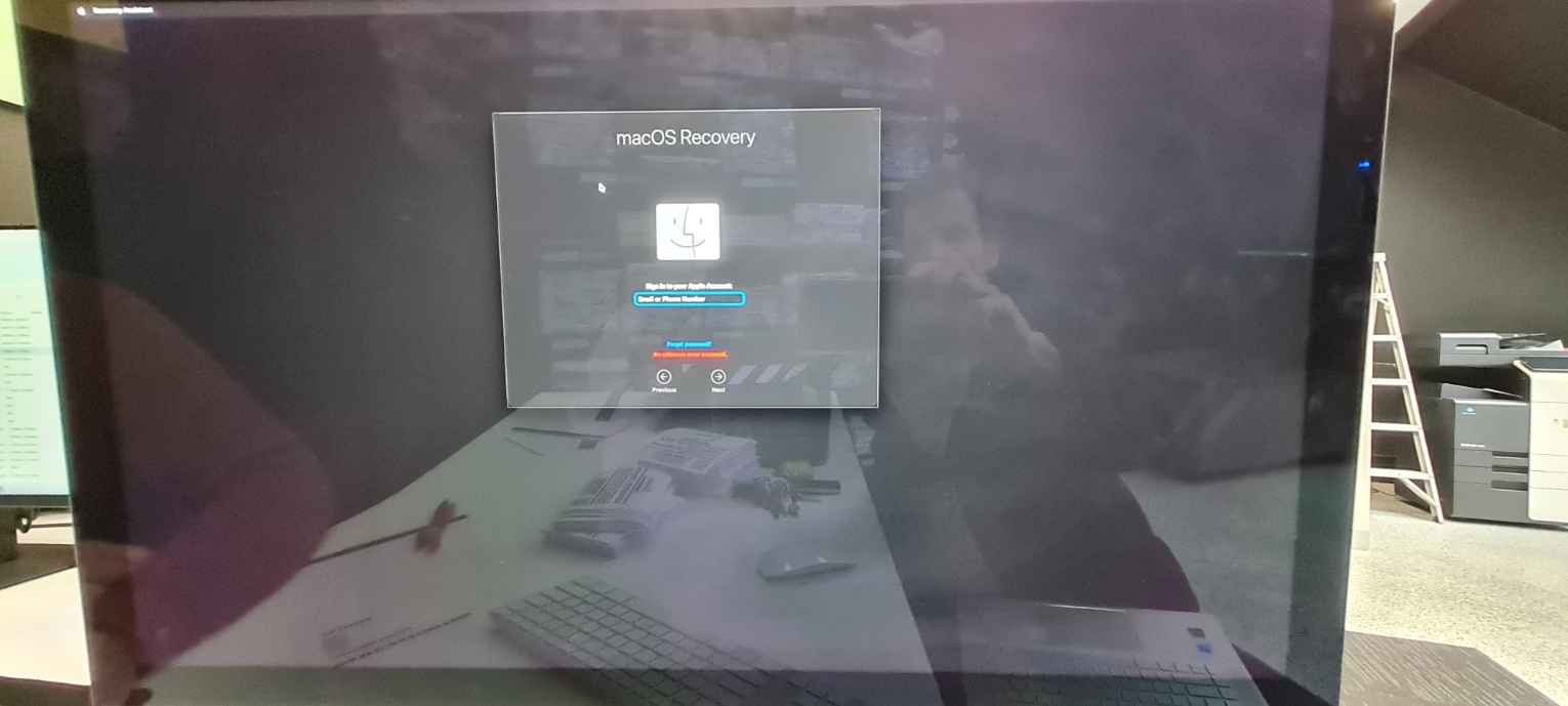 Close-up of macOS Recovery Apple Account sign-in screen on an iMac